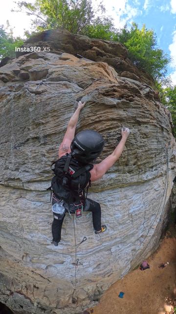 Reaching for a hold on a sandstone wall