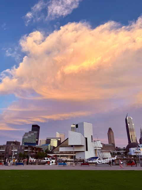 Pink sunset clouds over the Cleveland skyline and lakefront